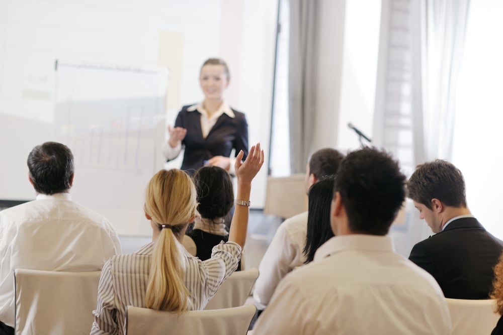 business people group at meeting seminar presentation in brigt conference room